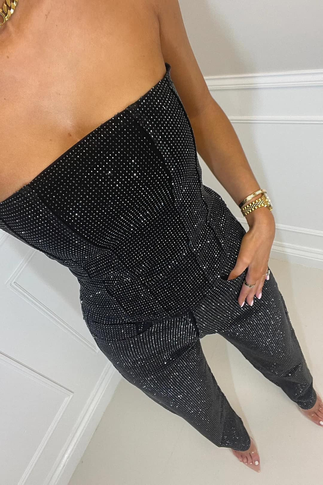 Sparkling Starlight women's strapless jumpsuit with sequins, ideal for special occasions & dazzling party look.