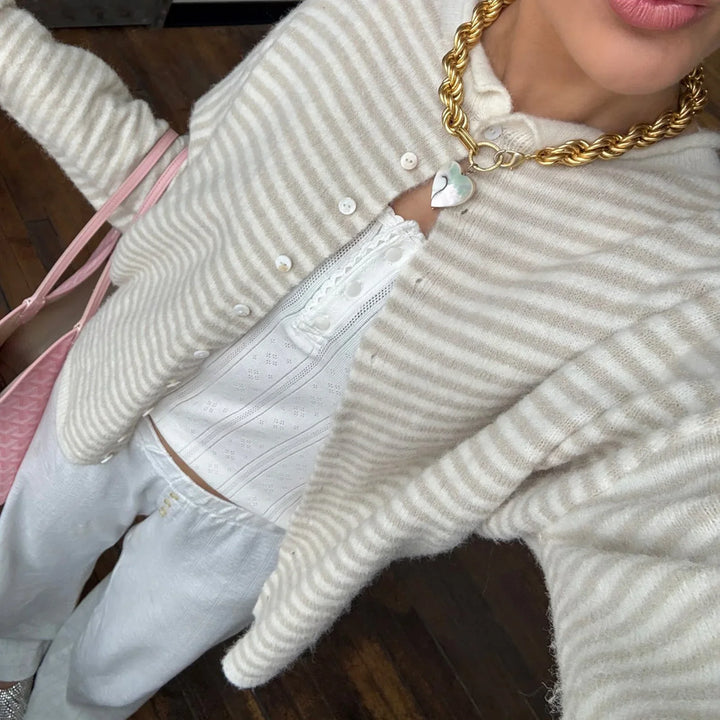 Casual women's striped cardigan with a button-front. Perfect for versatile, fashionable layering.
