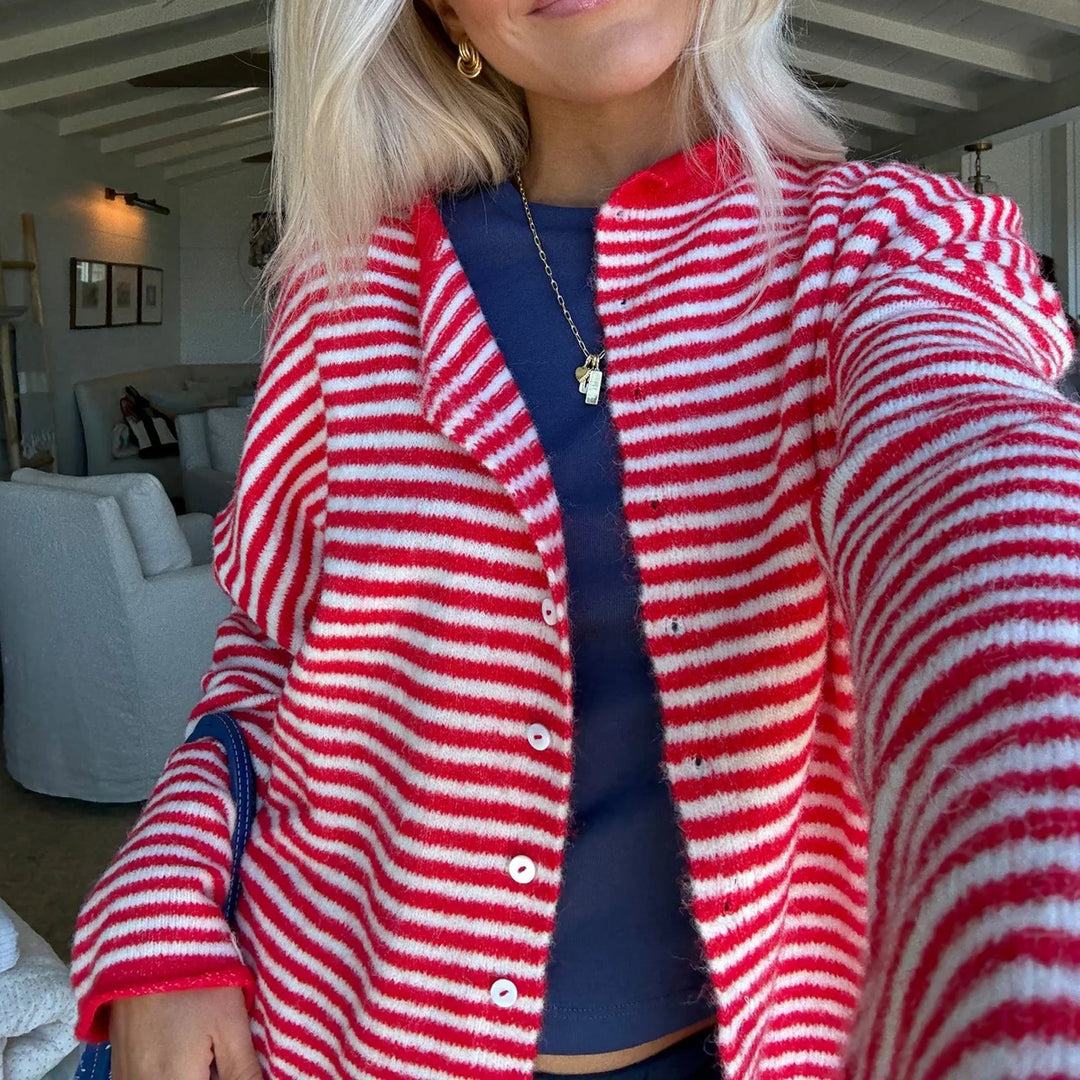 Model wearing a trendy women's striped button-front cardigan with a stand collar for casual style.