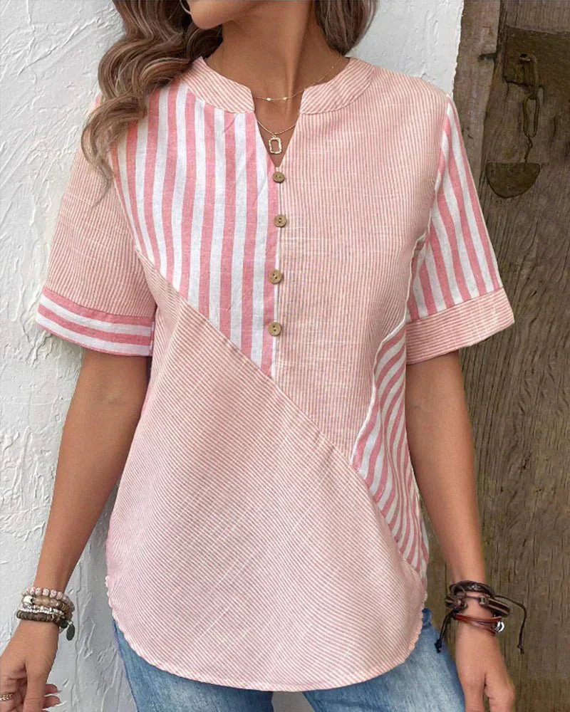 Modern ladies' colorblock blouse with stripes & half-button front, ideal for versatile casual fashion.
