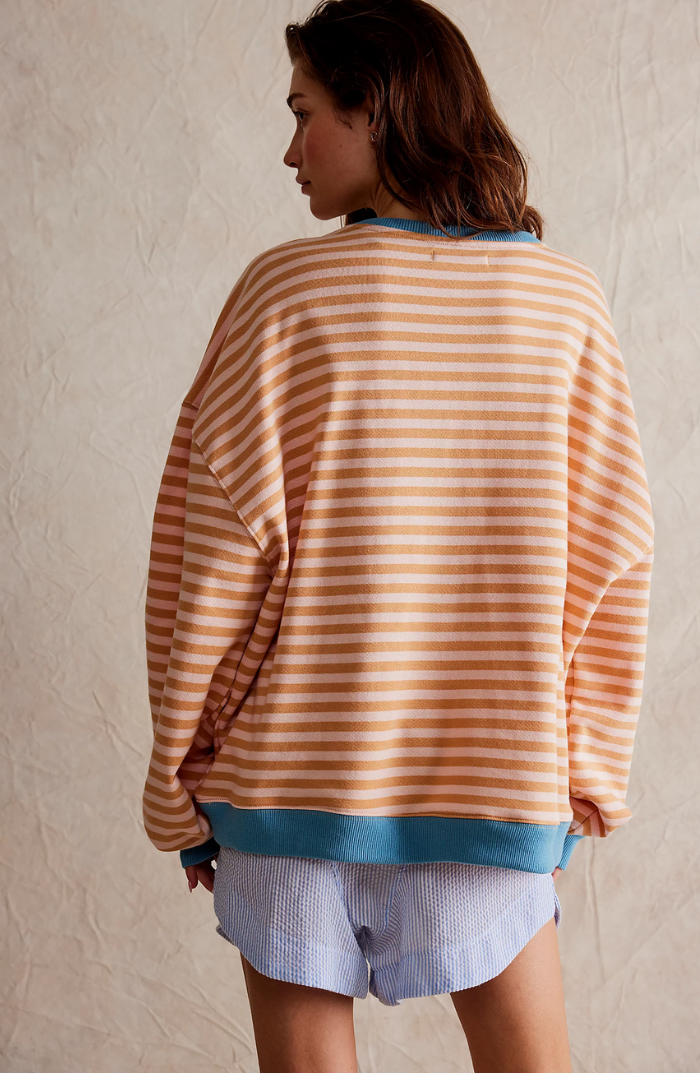 Comfortable women's striped long sleeve sweater, perfect for spring's cooler days.