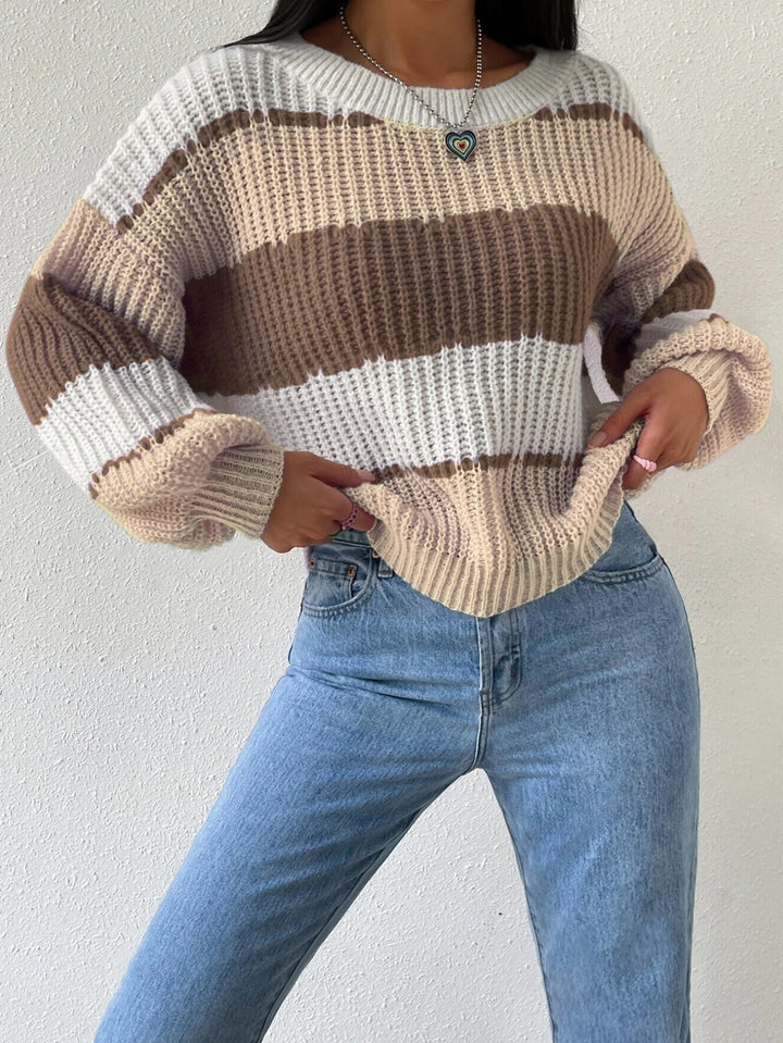 Close-up of the knit texture of a women's striped long-sleeve sweater