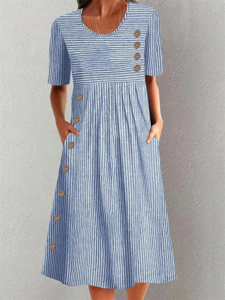 Women's striped midi dress with buttons and pockets, perfect for casual summer wear or elegant everyday style.