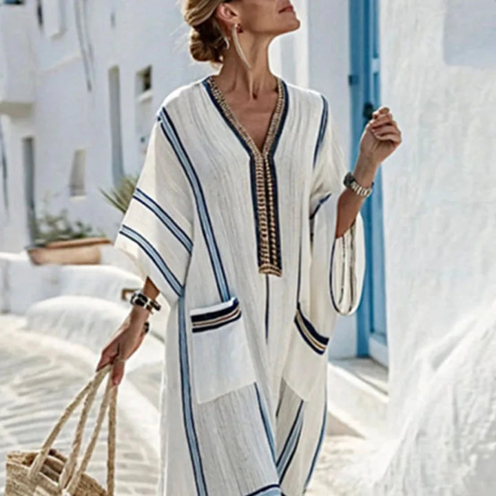 Oversized women's striped kaftan maxi dress, ideal casual loungewear or chic summer vacation outfit.