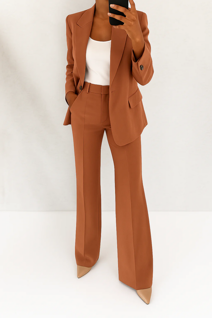 Modern structured women's blazer and trouser set, a sharp, elegant look for professional attire.