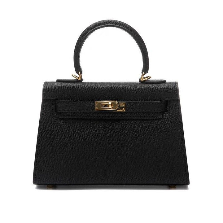 Elegant black women's handbag, a top handle crossbody with a distinctive turn lock and sleek design.
