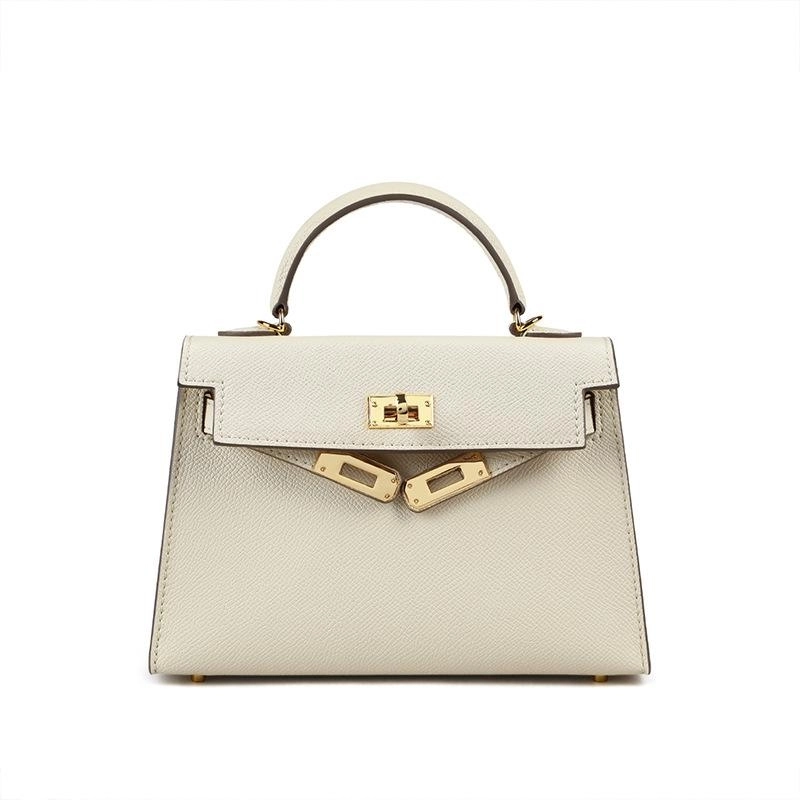 Classic black women's turn lock crossbody bag, also usable as a chic top handle or shoulder bag.