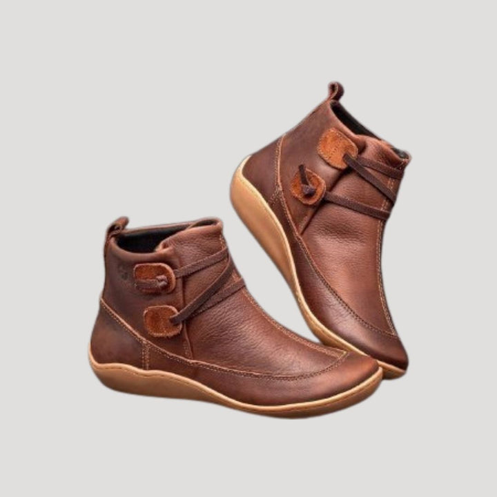 Women's stylish black ankle strap boots, perfect for spring casual footwear, offering versatile chic style.