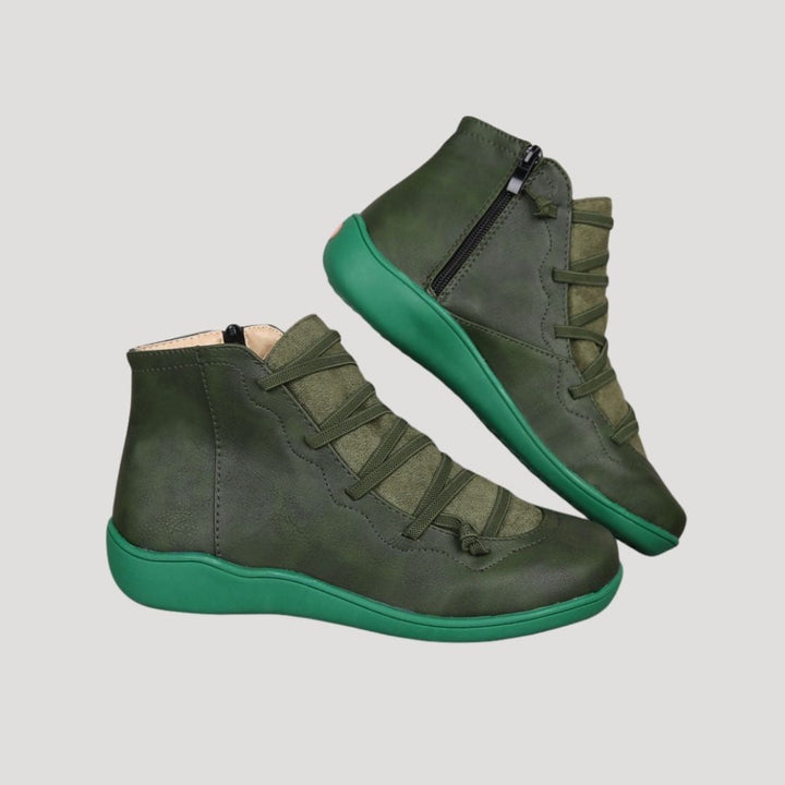 Pair of women's elegant ankle strap boots in black, a stylish and comfortable choice for spring fashion.