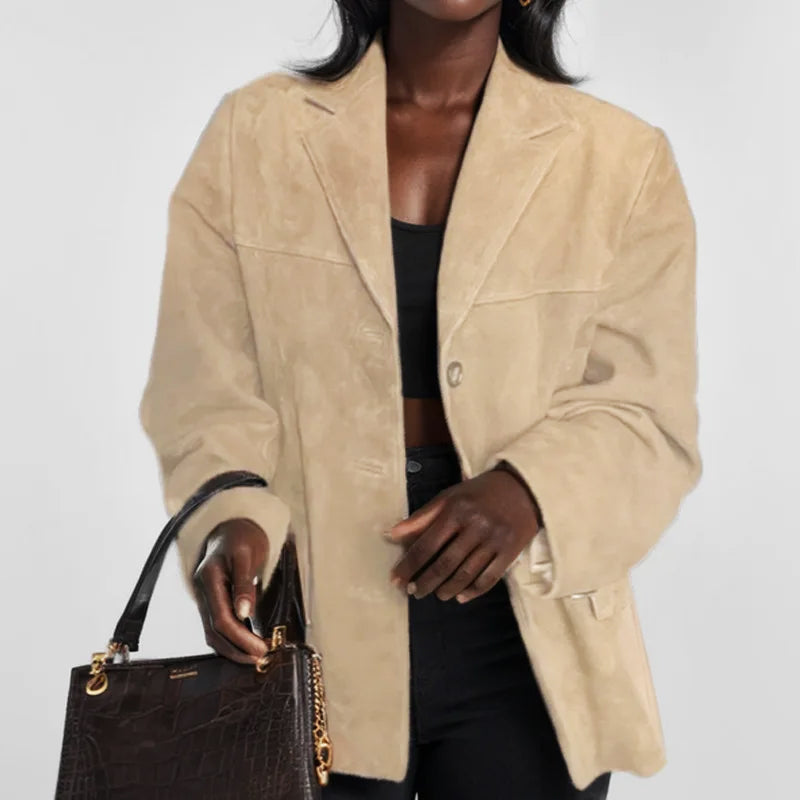 Elegant women's tailored blazer in a neutral color, featuring button closure, ideal for workwear fashion.