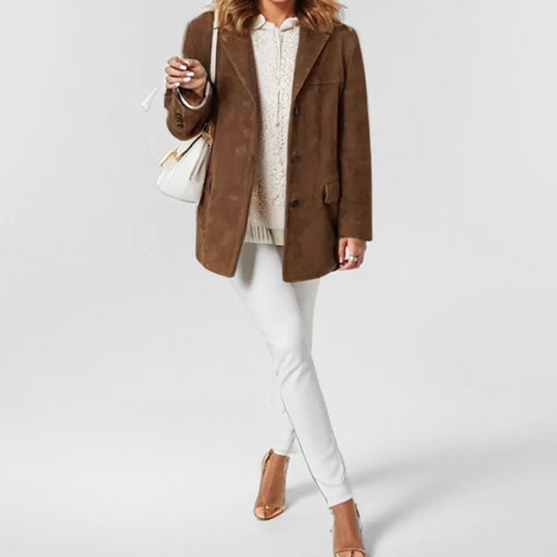 Full-length view of a woman wearing a sophisticated button-down blazer jacket, enhancing an elegant ensemble.