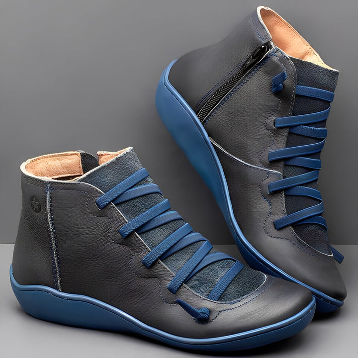 Pair of women's comfortable black ankle boots with lace-up front and convenient side zipper.