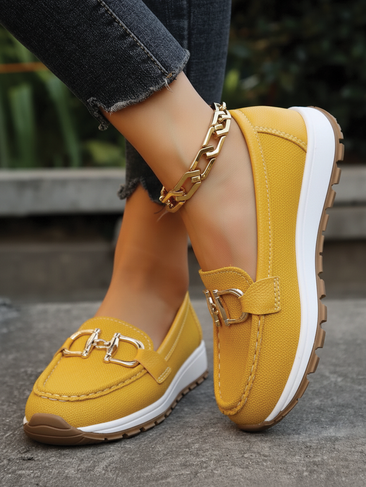Modern women's flat loafers with an elegant buckle for effortless, comfortable everyday wear. Work-friendly slip-ons.