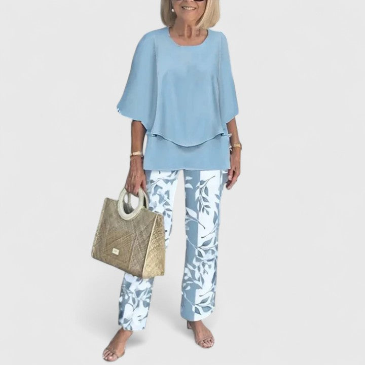 Comfortable women's two-piece set featuring a soft crew neck top and chic printed trousers for casual wear.