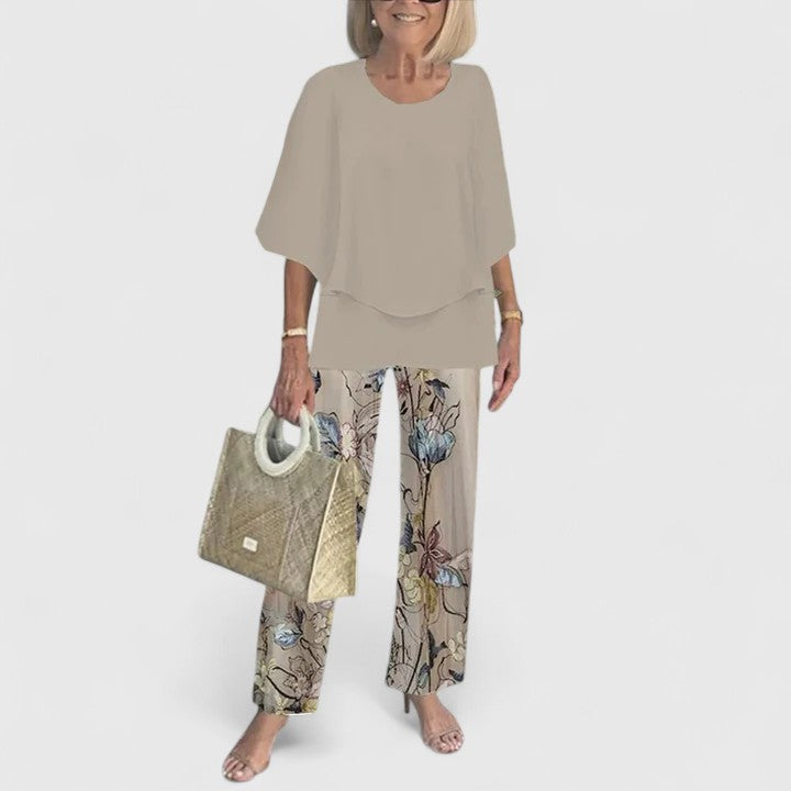 Fashionable women's casual set, including a relaxed half-sleeve top and bold printed trousers, for everyday comfort.