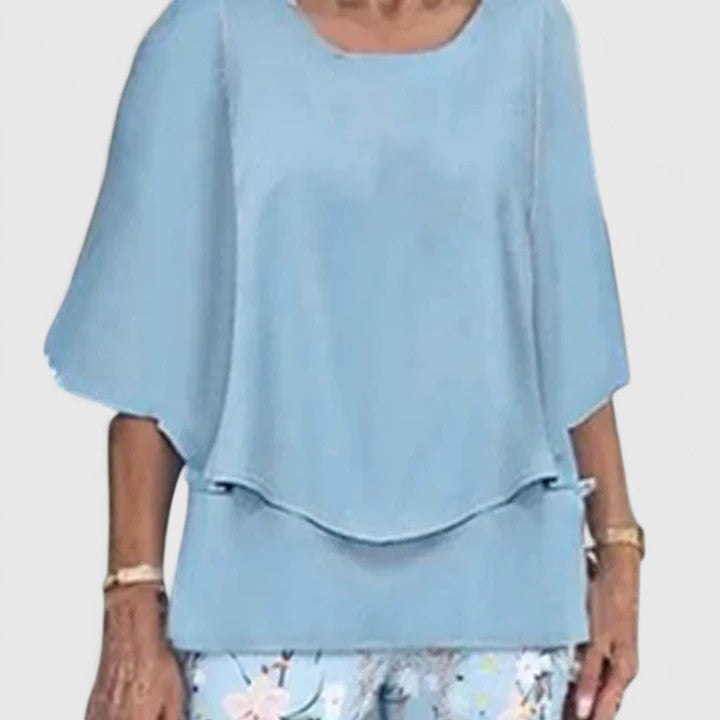 Stylish women's outfit: a comfy crew neck top paired with trendy printed pants, ideal for versatile casual wear.