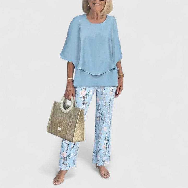 Women's two-piece leisure wear: a half-sleeve top & unique printed pants. A perfect blend of comfort and style.