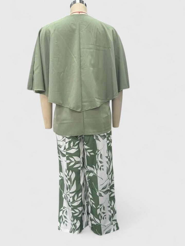 Casual chic women's outfit featuring a simple crew neck top and vibrant printed pants for a relaxed fashion look.