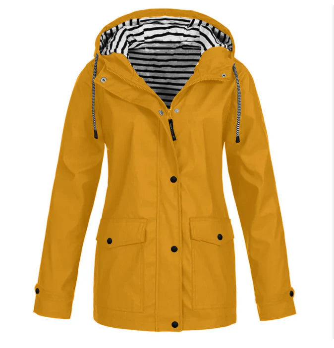 Hooded women's waterproof raincoat. Stylish and lightweight jacket for spring and fall rain protection.