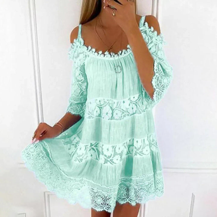 Casual women's short summer dress for beach or vacation, with elegant crochet and floral embroidery.