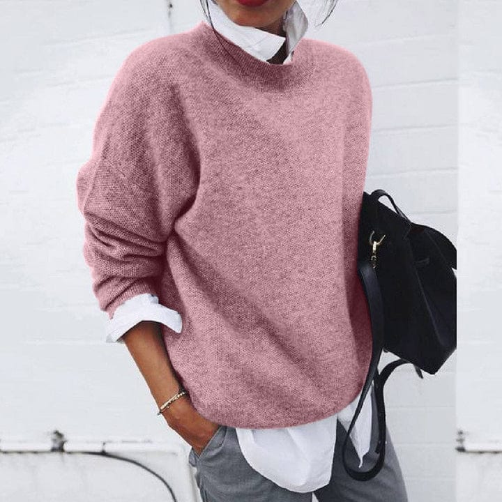 Close-up of a women's cozy round neck knit pullover, highlighting the super soft texture and long sleeves.