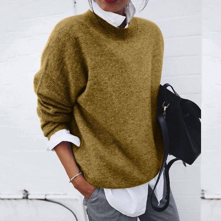 Folded super soft knit women's pullover with a round neck, showcasing the soft texture and quality.