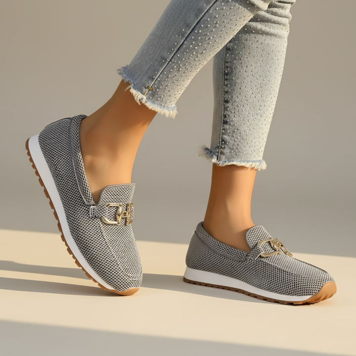 Woman wearing Suzane orthopedic loafers, enjoying comfortable all-day support for walking or work.