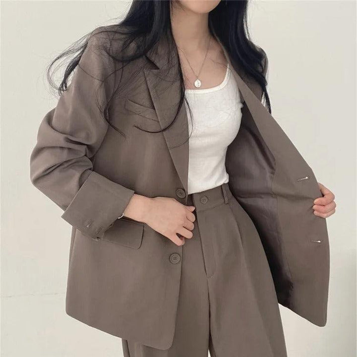 Statement women's tailored suit set with an elongated blazer, perfect for making an impression.