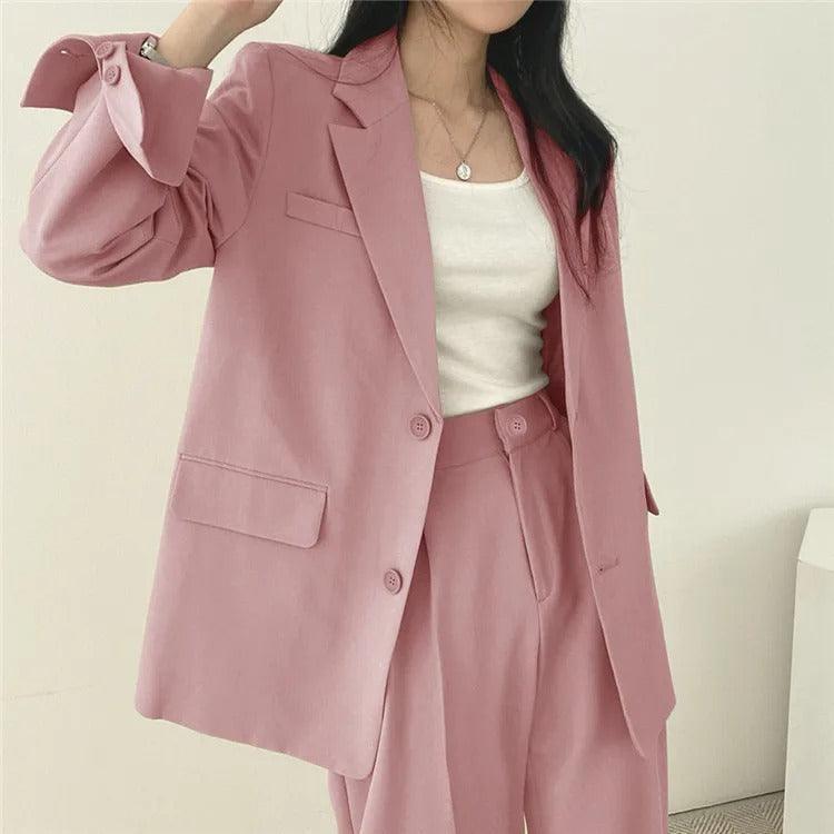 Elegant women's tailored suit set with a long blazer, designed for a sharp business look.