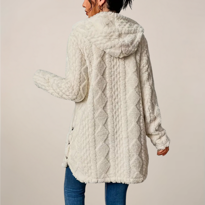 Stylish women's hooded knit cardigan, a longline design suitable for spring fashion and comfort