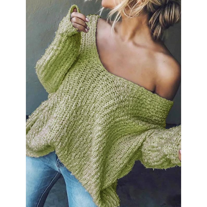 Model wearing a women's textured knit V-neck sweater, demonstrating a comfortable fit.