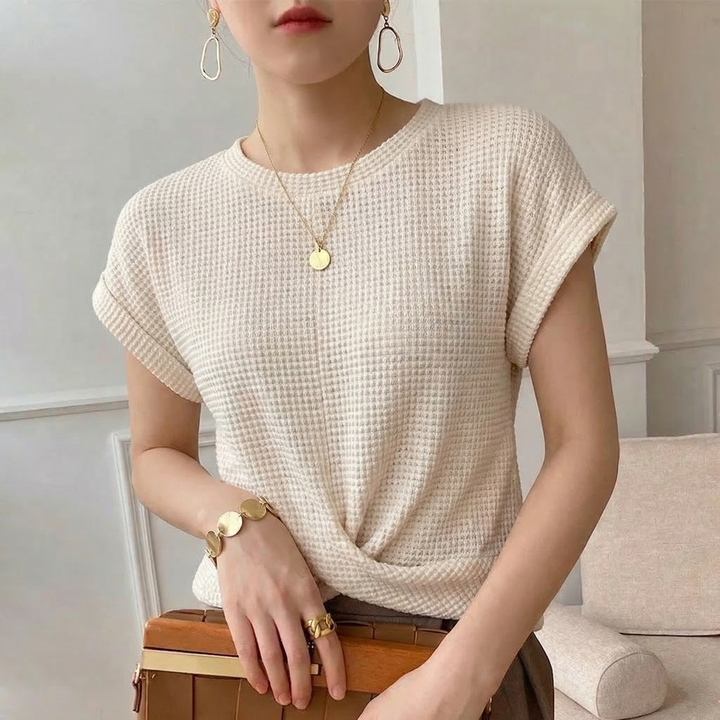 Women's long sleeve textured twist front top, a chic and modern blouse for versatile wear.