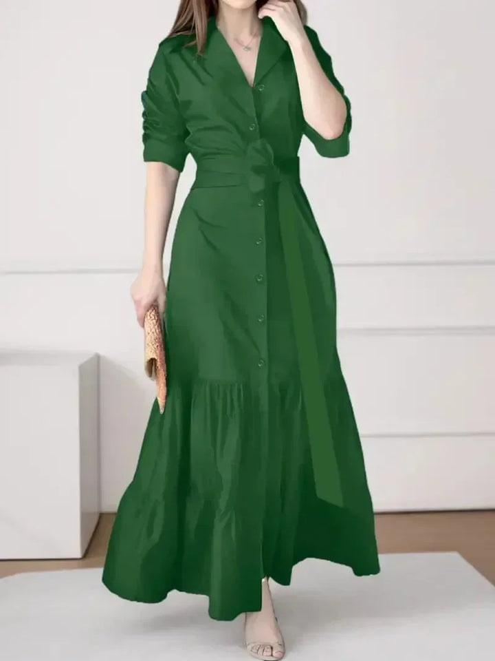 Sophisticated women's tiered maxi shirt dress. A-line design, tie waist, and button-down front for elegant casual.