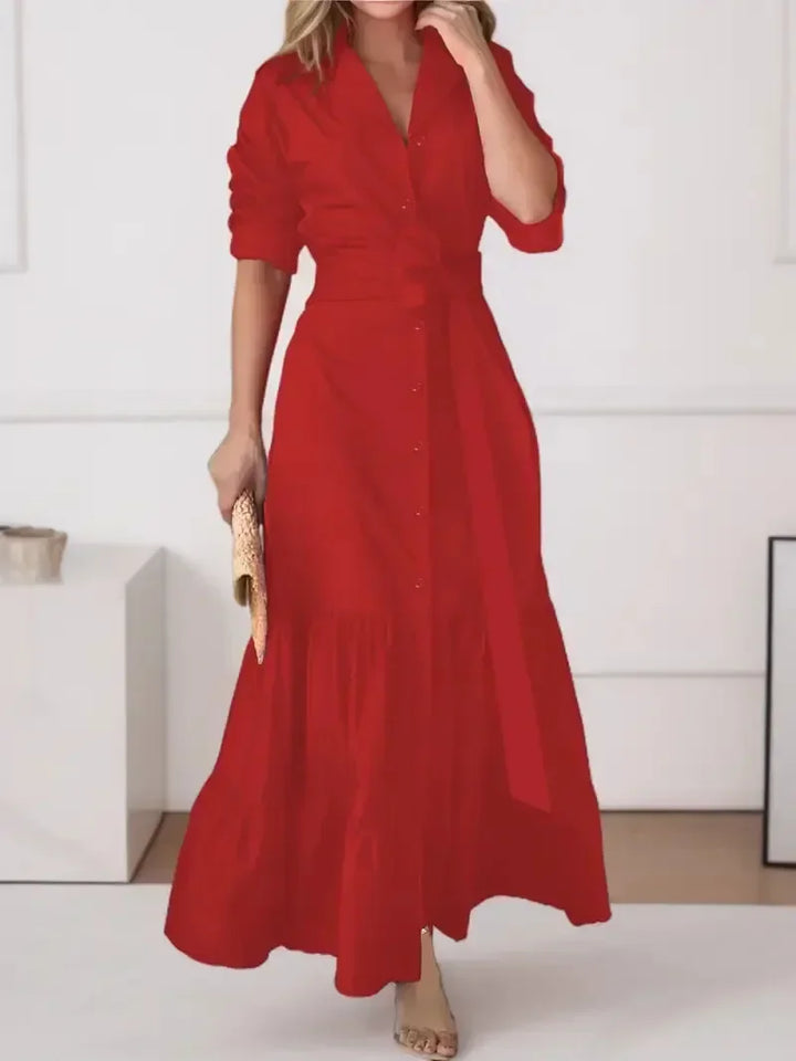 Women's A-line tiered maxi shirt dress. Features button-down front, long sleeves & flattering tie waist detail.