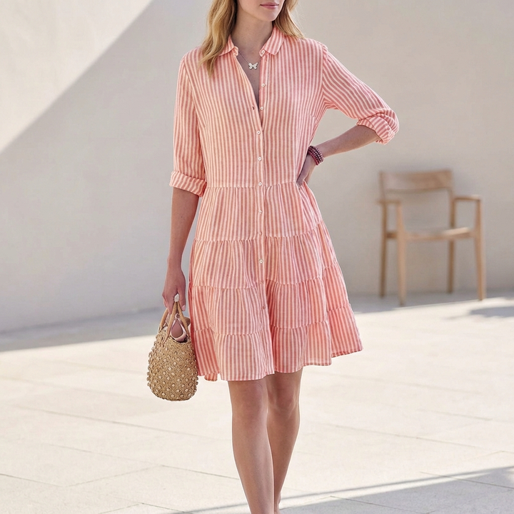 Elegant women's button-down tiered mini dress, featuring 3/4 sleeves & V-neck. Ideal for spring fashion.