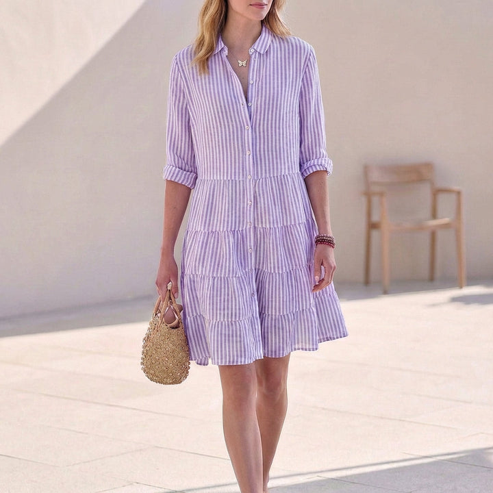 Effortless women's mini dress, button-down front & tiered design. A versatile V-neck casual or elegant dress.