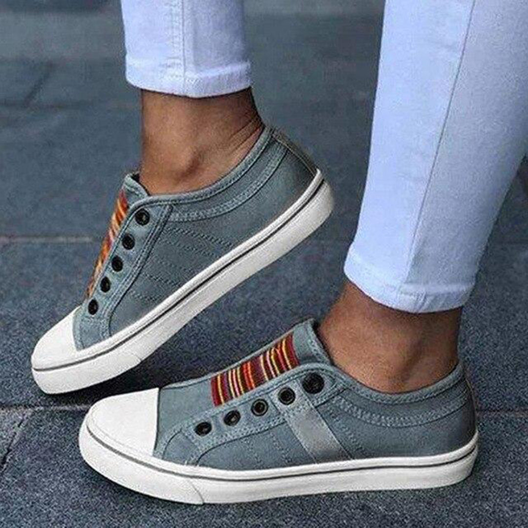 Women's trendy low-top slip-on sneakers in a neutral color, perfect for casual everyday wear.