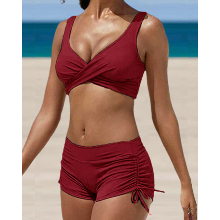 Confident women's two-piece high-waist bikini. Stylish beachwear with a flattering fit for summer.
