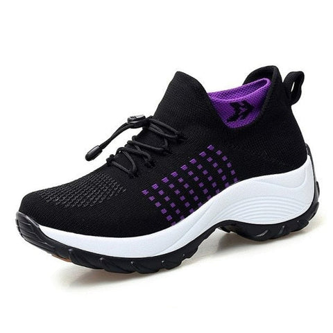 Lightweight women's slip-on sneakers featuring breathable stretch fabric and a plush cushioned footbed.