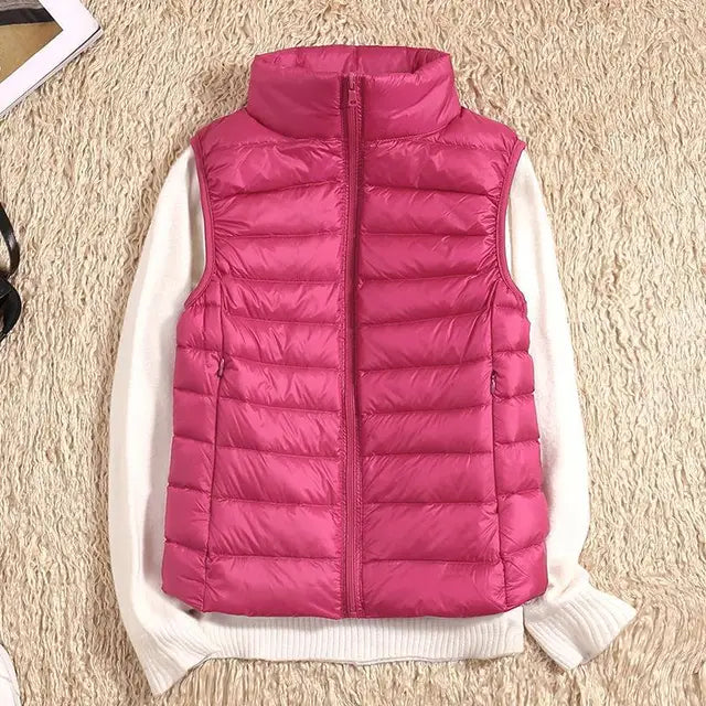 Women's warm, packable & ultra-light down vest – essential layering piece for fall, winter & travel.