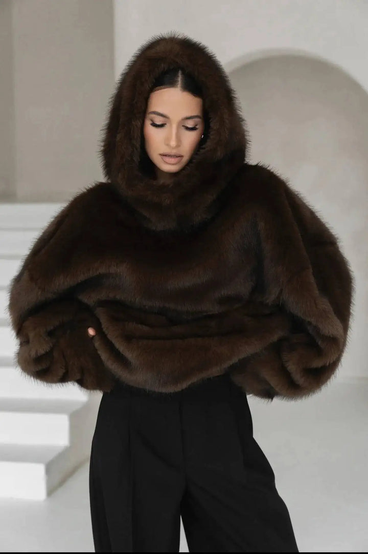 Warm women's oversized pullover hoodie, perfect for fall fashion & winter comfort. Features a soft feel & drop shoulder.
