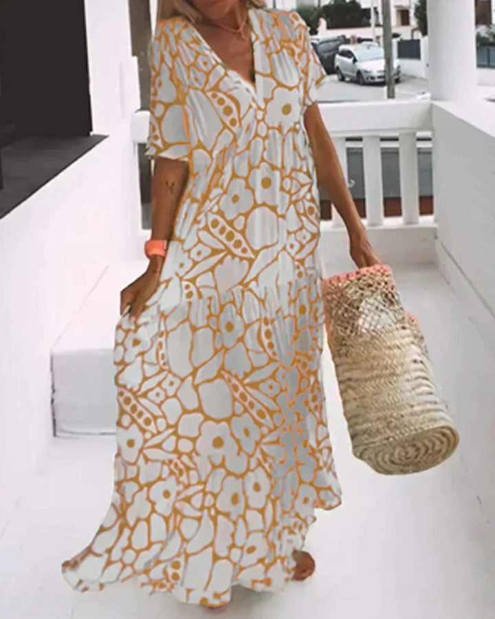 Stylish V-neck maxi dress for women, featuring a vibrant abstract print, perfect for summer vacation.