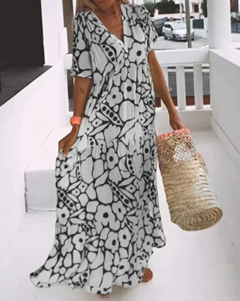 Comfortable women's summer maxi dress with a flattering V-neck and unique abstract print.