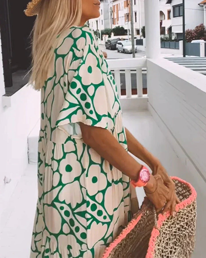 Close-up of abstract print V-neck maxi dress, showcasing the unique pattern and soft fabric.