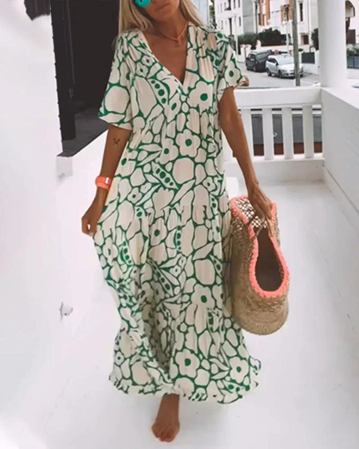 Flowy abstract print V-neck maxi dress, a chic women's summer style for vacation and casual outings.