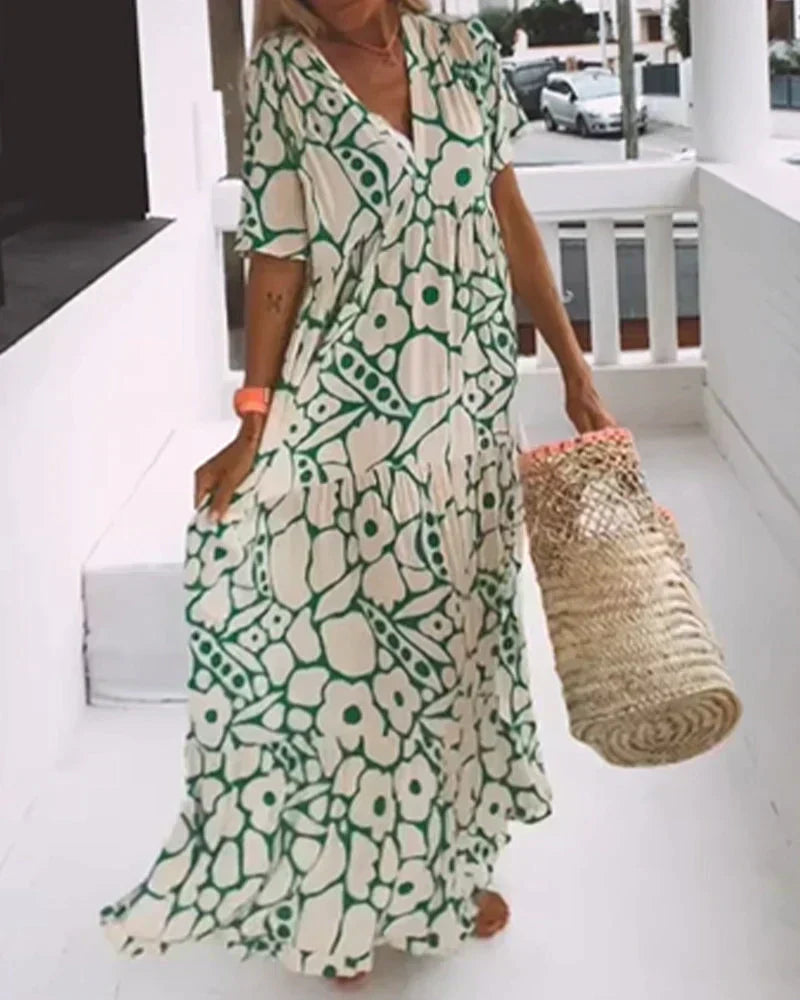 Model in a beautiful V-neck abstract print maxi dress, a versatile women's summer outfit.