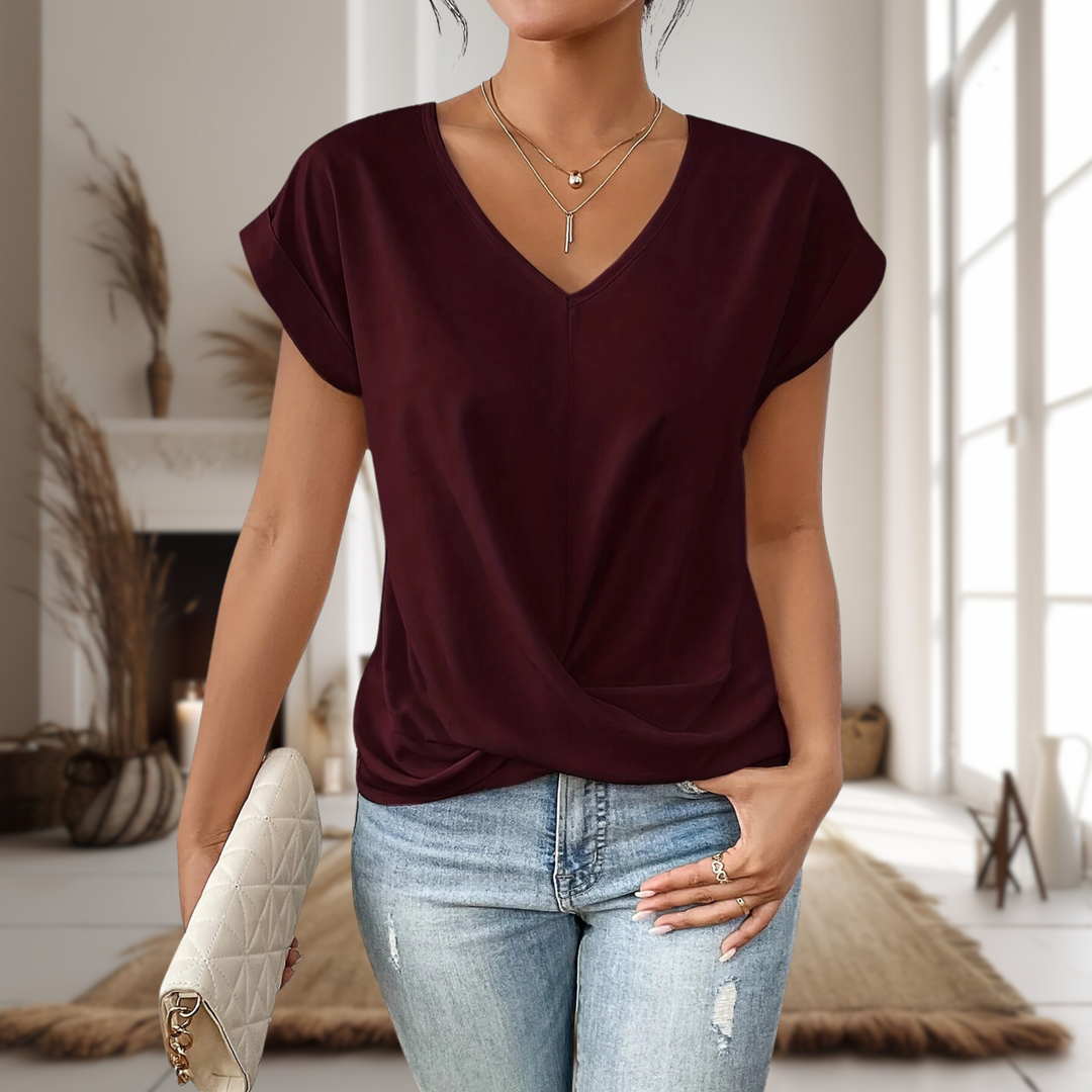 Women's V-neck blouse with chic twisted hem and short sleeves, perfect for casual elegance.