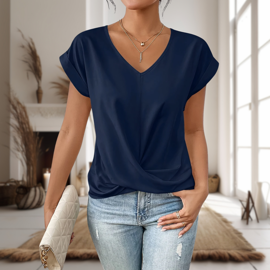 Women's stylish V-neck blouse with twisted hem. Short sleeve casual top for modern fashion.