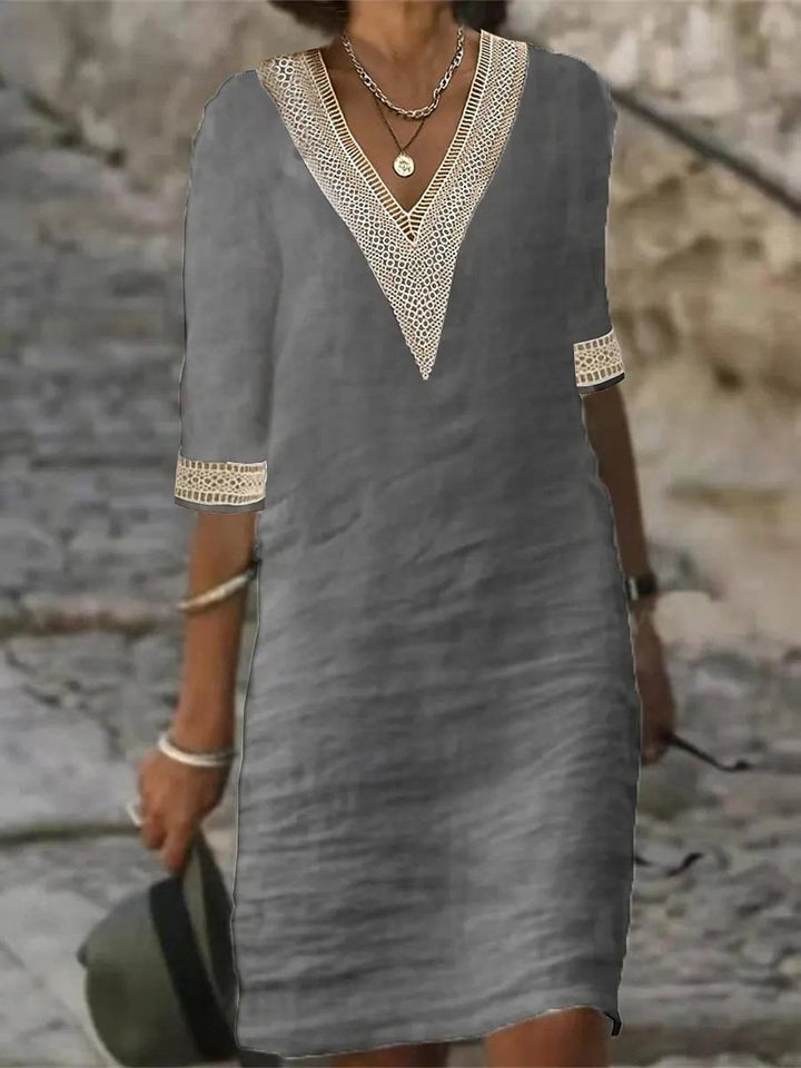 Breathable knee-length women's dress. Features a relaxed fit & 3/4 sleeves for casual comfort.