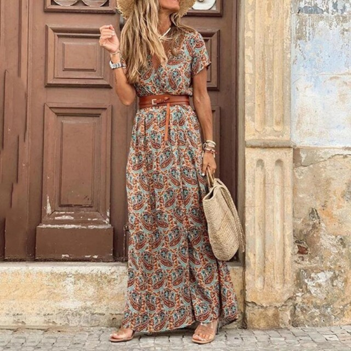 Vibrant floral print maxi dress with V-neck and adjustable belt, a comfortable and chic option for sunny days.